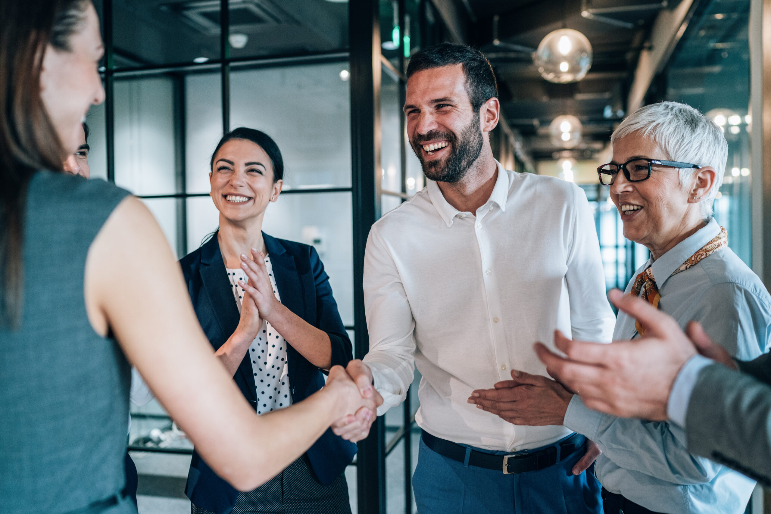 Cheerful Business people shaking hands in the office