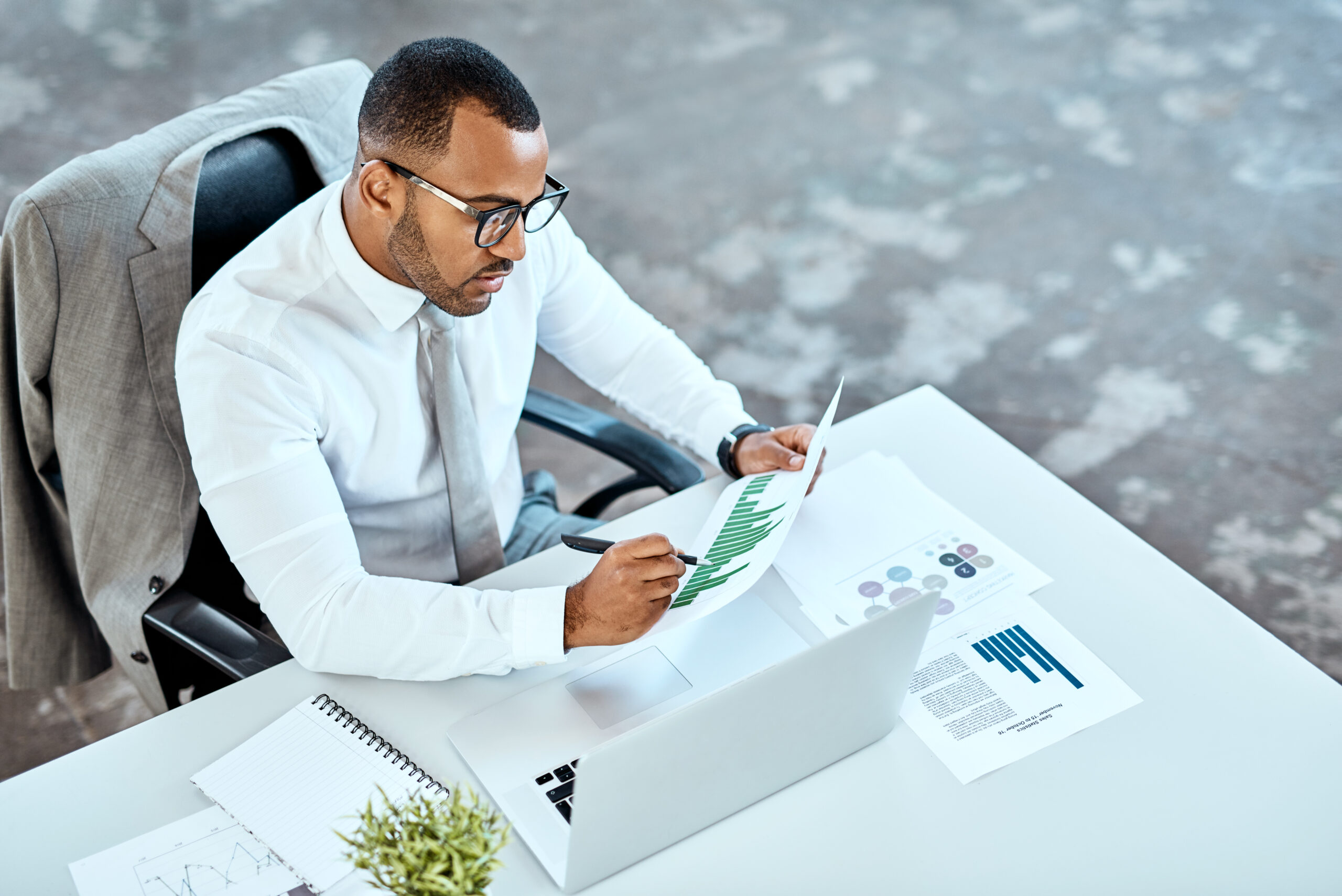 High angle shot of a young businessman working in an office