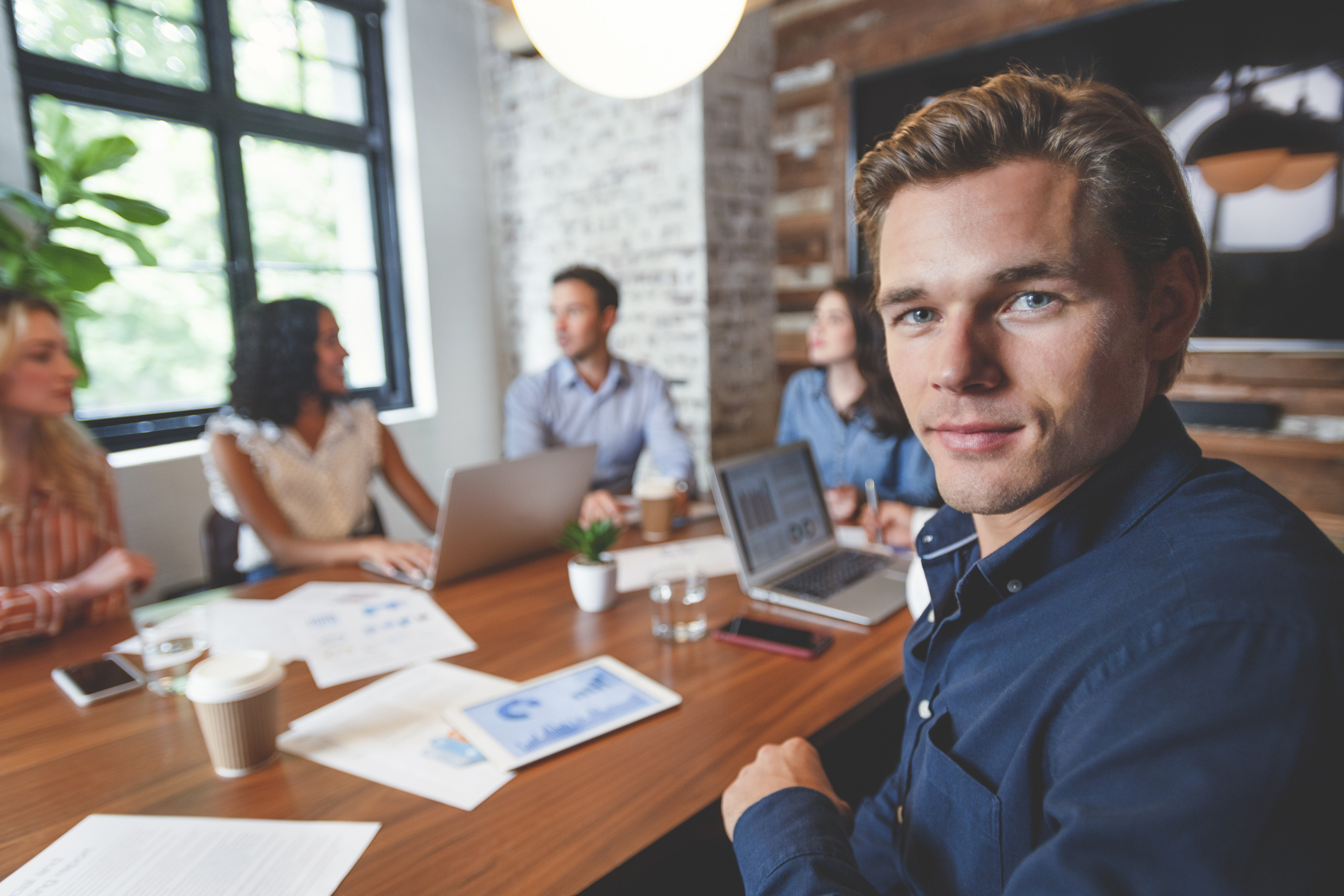 Group of people meeting with technology.