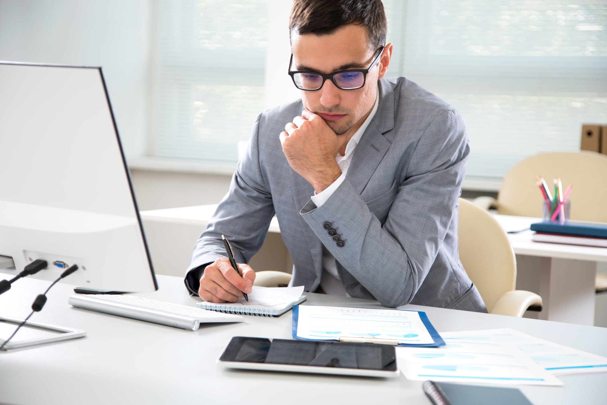 Young handsome businessman working in an office