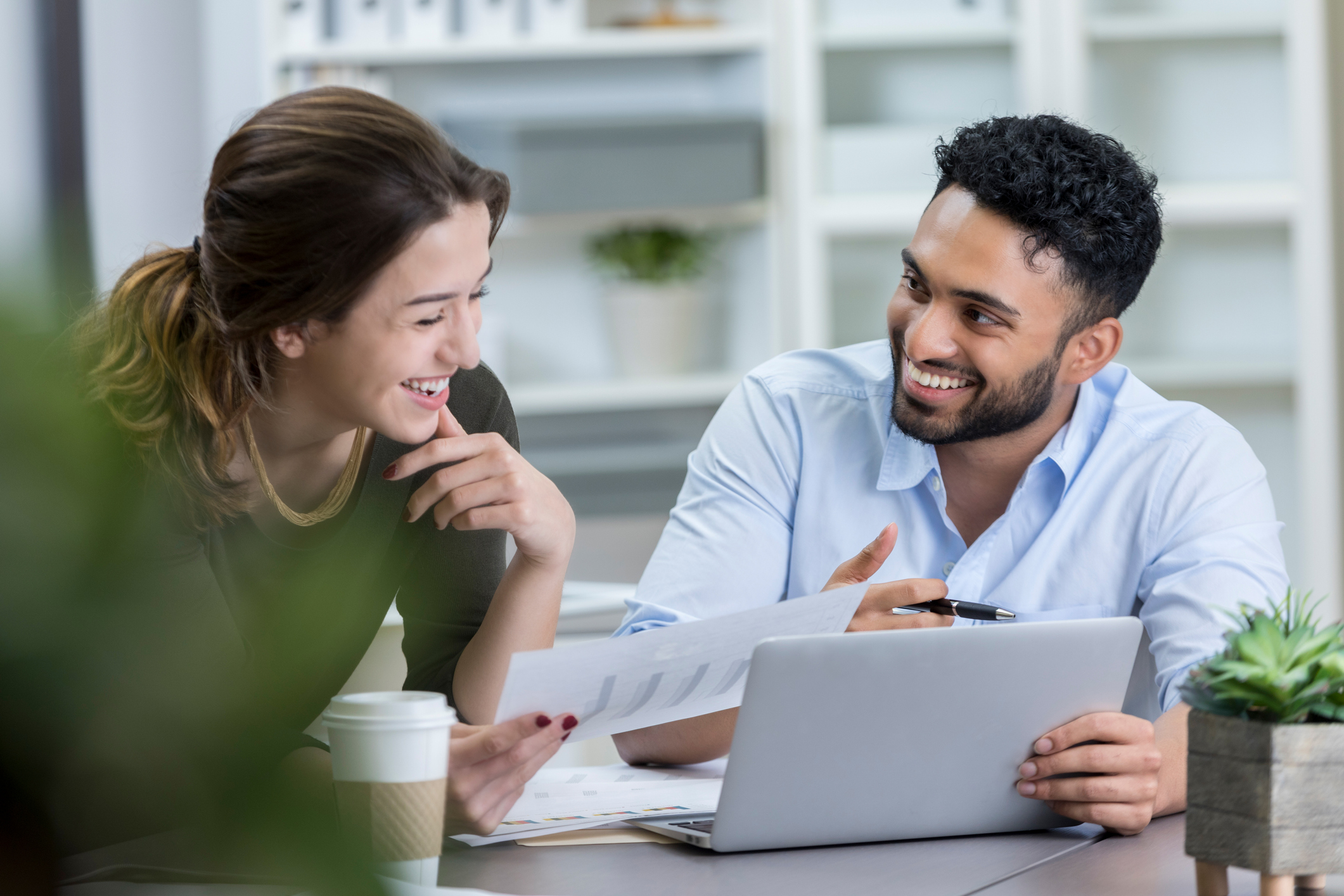 Cheerful Male And Female Business People Participate In Meeting