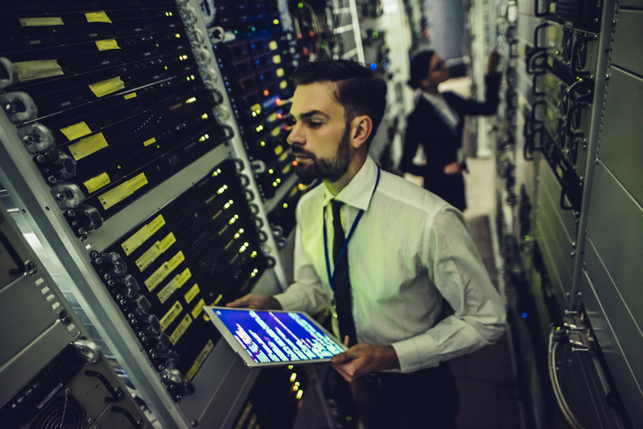 Handsome Man And Attractive Woman Are Working In Data Centre