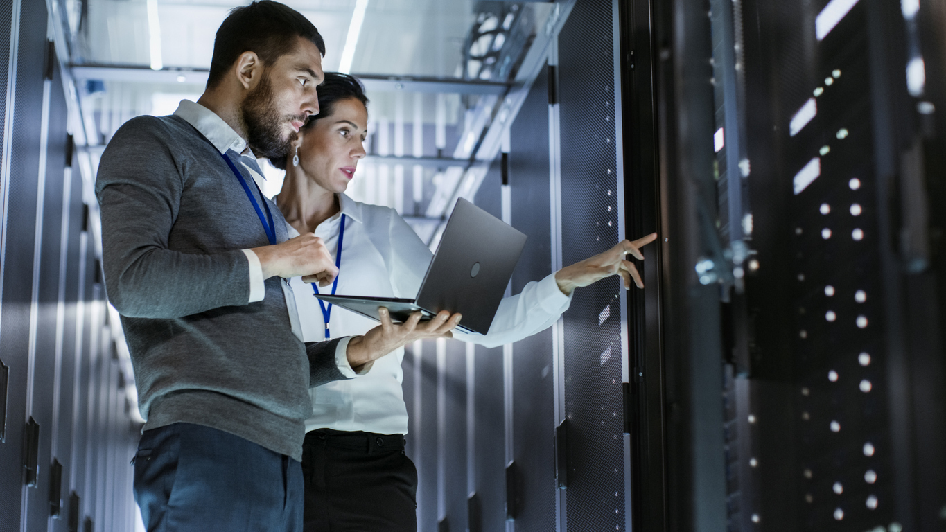 Woman and Man Discussing Data Warehouse Architecture